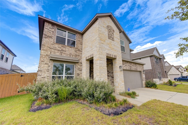 view of front of property featuring a garage and a front lawn