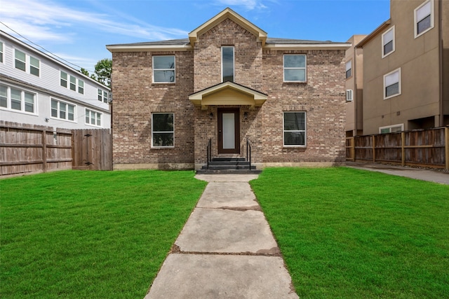 view of front of house with a front lawn