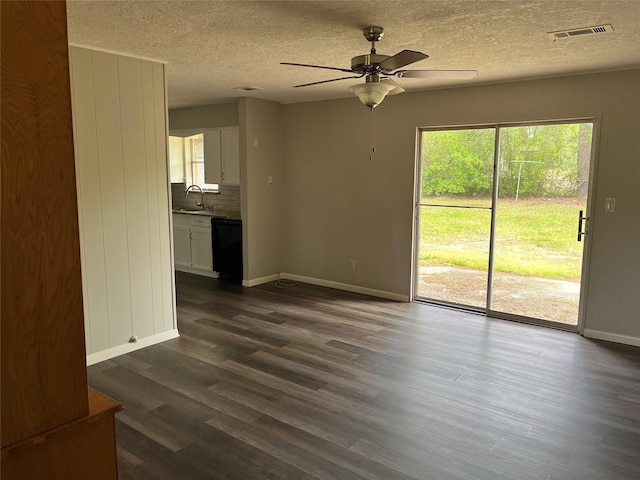 1801 Southline St, Cleveland, TX 77327 - unfurnished living room featuring a sink, ceiling fan, dark wood-style floors, a textured ceiling, and baseboards