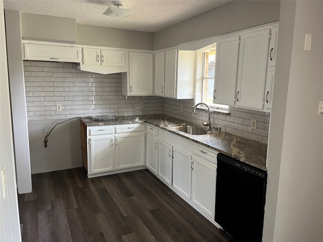 kitchen featuring black dishwasher, a textured ceiling, sink, and white cabinets