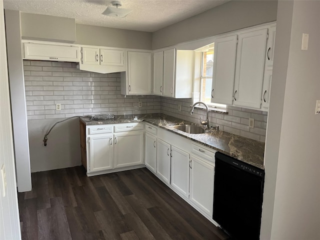 1801 Southline St, Cleveland, TX 77327 - kitchen with black dishwasher, a sink, a textured ceiling, backsplash, and white cabinetry