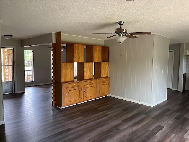 1801 Southline St, Cleveland, TX 77327 - unfurnished room featuring a ceiling fan, baseboards, dark wood-style floors, and a textured ceiling