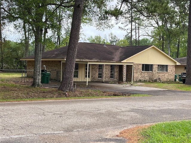 1801 Southline St, Cleveland, TX 77327 - ranch-style home featuring asphalt driveway and brick siding
