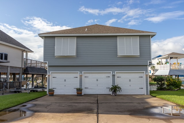 exterior space with a lawn and a garage