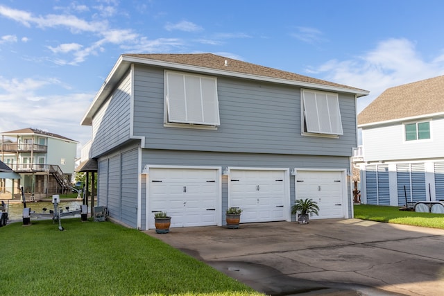 exterior space with a garage and a front lawn