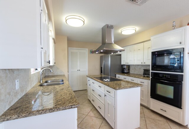 kitchen featuring white cabinetry, island exhaust hood, black appliances, a center island, and sink