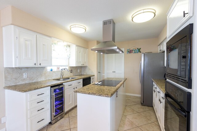 kitchen featuring wine cooler, white cabinets, island range hood, black appliances, and sink