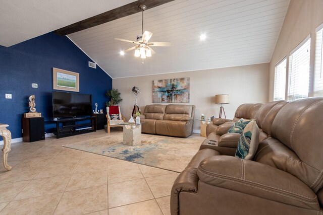 tiled living room featuring ceiling fan, beamed ceiling, and high vaulted ceiling