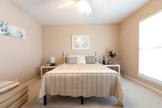 bedroom with ceiling fan and carpet floors