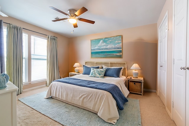 carpeted bedroom featuring ceiling fan