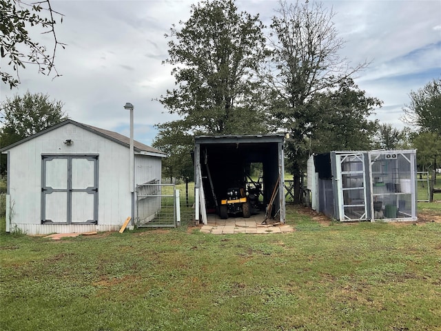 view of outbuilding featuring a lawn