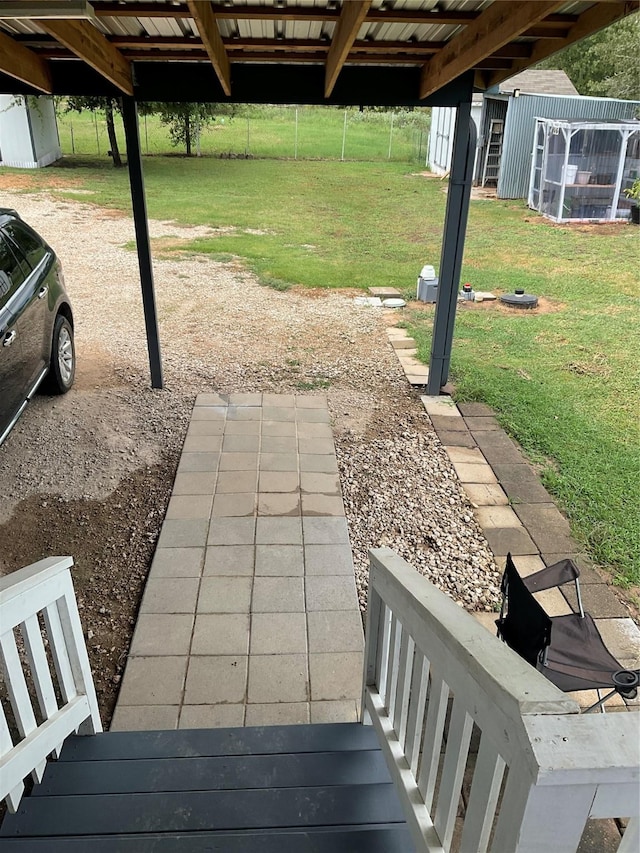 view of patio featuring a storage shed