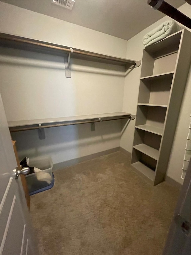 walk in closet with carpet flooring and visible vents