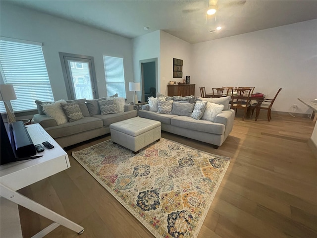 living room featuring wood finished floors and ceiling fan