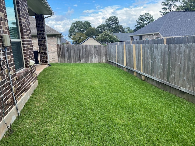 view of yard featuring fence