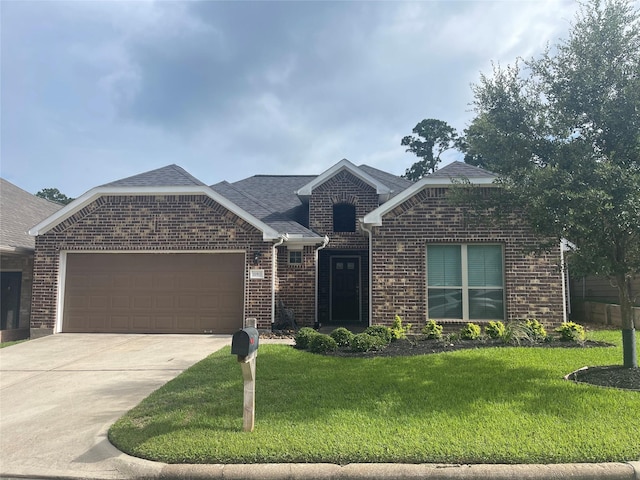 ranch-style house featuring brick siding, concrete driveway, a front yard, roof with shingles, and an attached garage