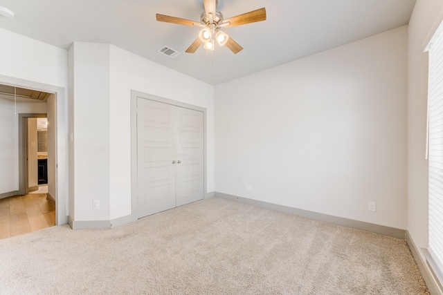 11913 Mockingbird Ln, Montgomery, TX 77356 - unfurnished bedroom with carpet, attic access, baseboards, a closet, and ceiling fan