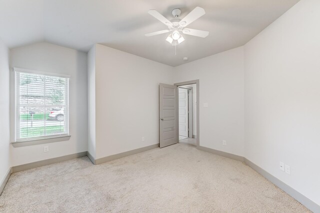 11913 Mockingbird Ln, Montgomery, TX 77356 - unfurnished bedroom featuring carpet floors, baseboards, ceiling fan, and vaulted ceiling