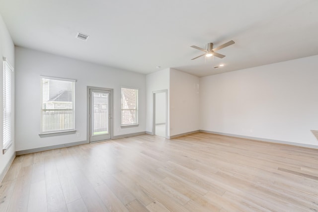 11913 Mockingbird Ln, Montgomery, TX 77356 - spare room featuring healthy amount of natural light, a ceiling fan, and light wood finished floors