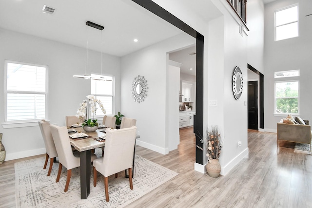 dining space featuring light wood-type flooring