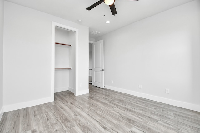 unfurnished bedroom with a closet, ceiling fan, and light hardwood / wood-style floors