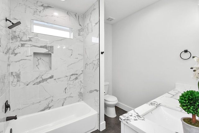 full bathroom featuring vanity, toilet, and tiled shower / bath