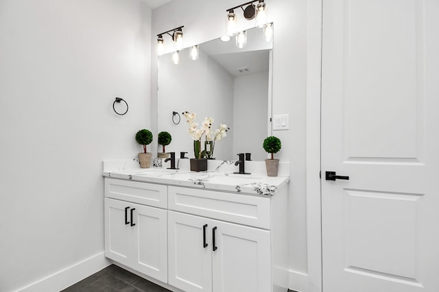 bathroom with tile patterned floors and vanity