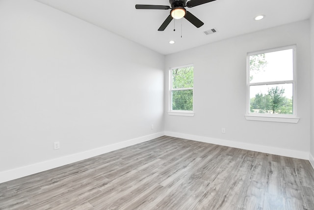 unfurnished room with ceiling fan and light hardwood / wood-style flooring