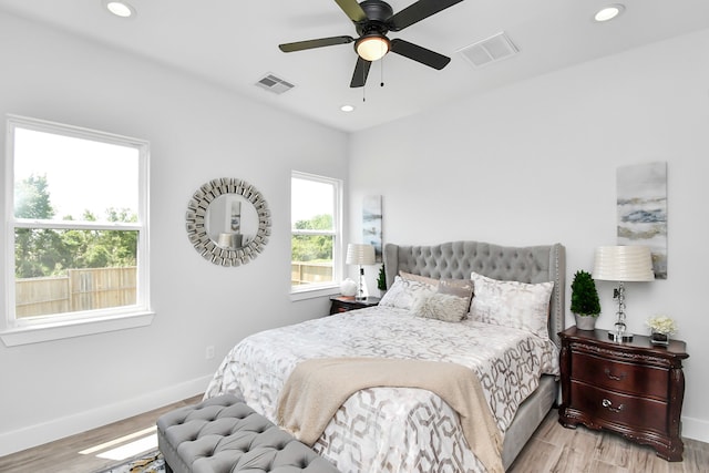 bedroom featuring light wood-type flooring and ceiling fan