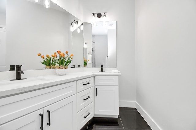 bathroom with vanity and tile patterned flooring