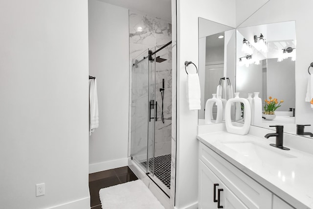 bathroom featuring tile patterned floors, an enclosed shower, and vanity