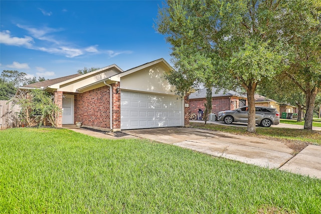 ranch-style home featuring a garage and a front yard