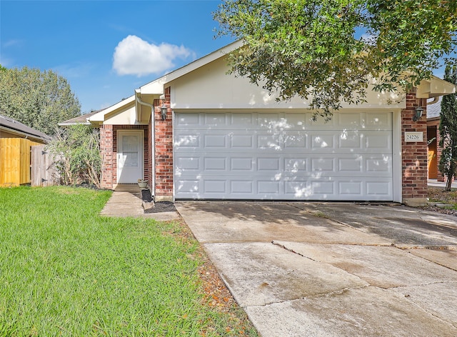 ranch-style house with a front yard and a garage