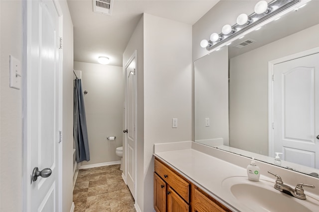 bathroom with vanity, toilet, and a shower with shower curtain