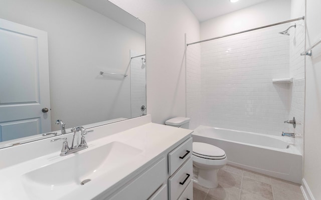 full bathroom with toilet, tiled shower / bath combo, vanity, and tile patterned flooring