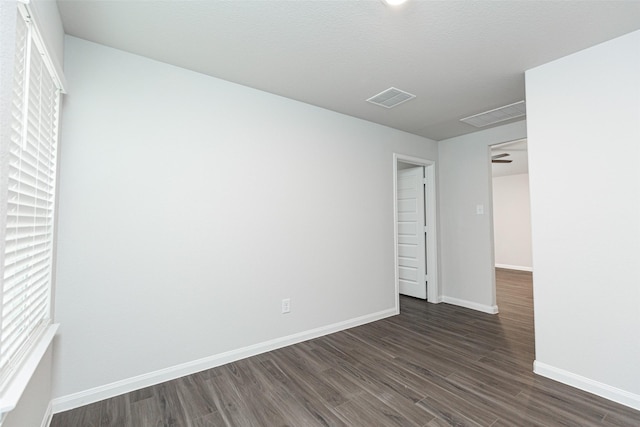 empty room featuring dark hardwood / wood-style floors