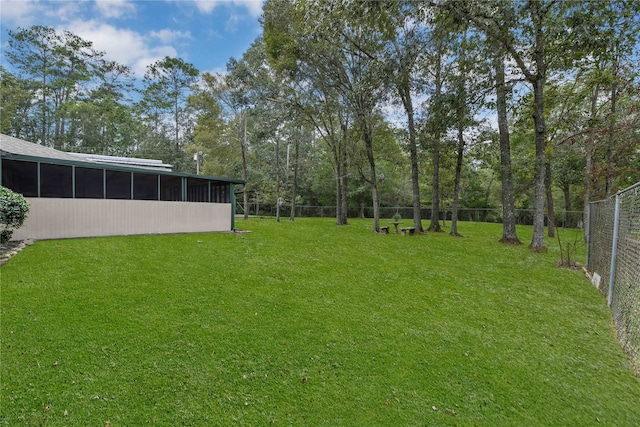 view of yard with a sunroom