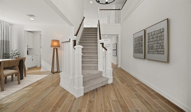 staircase featuring hardwood / wood-style floors