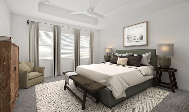 bedroom with light colored carpet, a raised ceiling, and ceiling fan