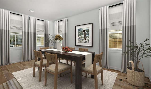 dining space featuring wood-type flooring