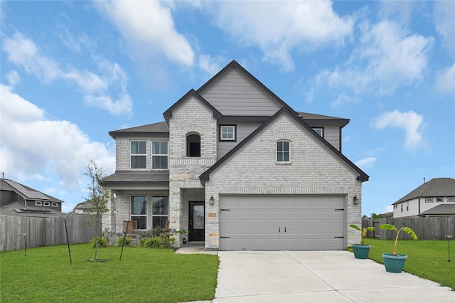 view of front facade featuring a garage and a front lawn