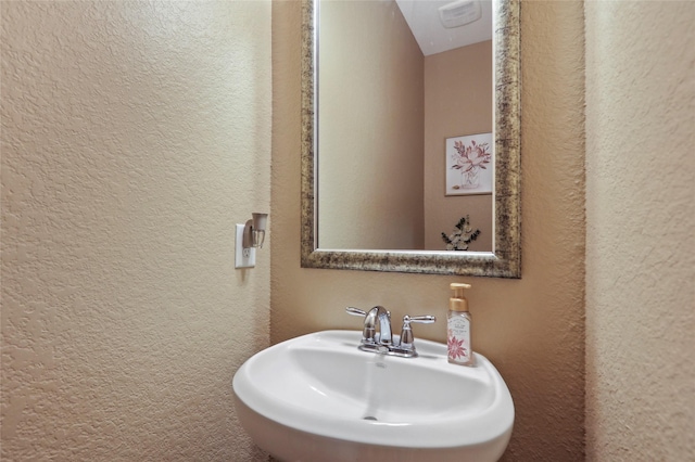 13423 Astley Acres Ln, Cypress, TX 77429 - bathroom with a textured wall, visible vents, and a sink