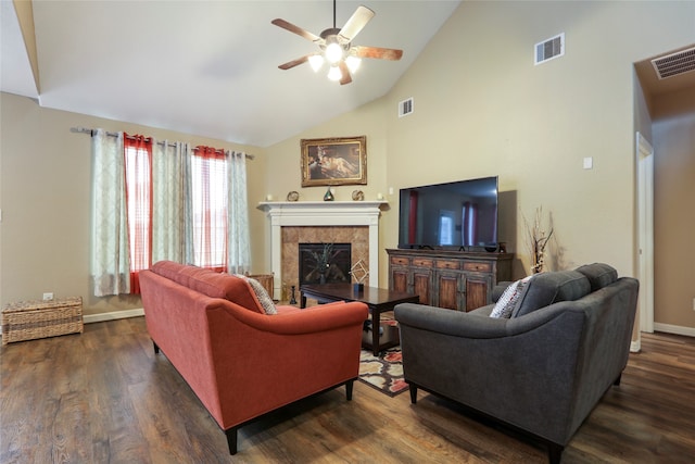 living room featuring a tile fireplace, dark hardwood / wood-style flooring, ceiling fan, and high vaulted ceiling