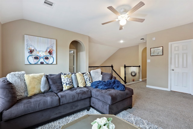 carpeted living room with vaulted ceiling and ceiling fan