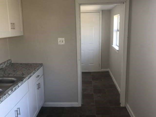 kitchen with sink and white cabinetry