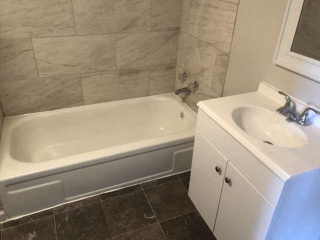 bathroom with tile patterned flooring and vanity