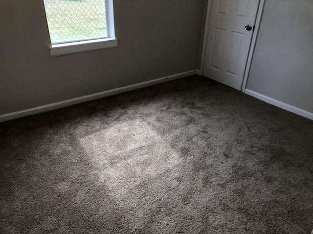 unfurnished bedroom featuring carpet