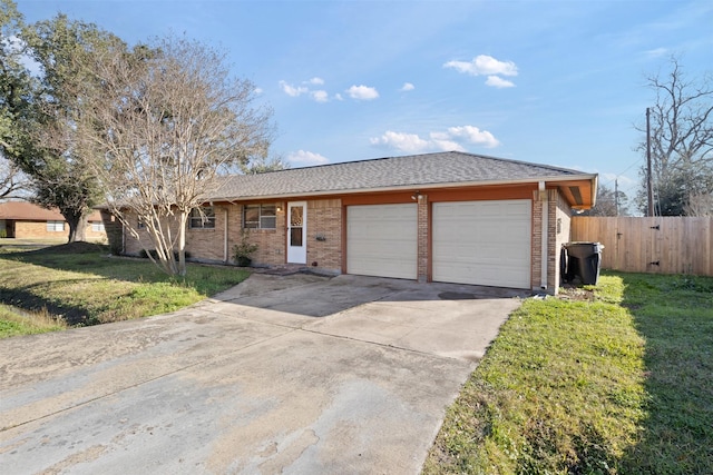 single story home featuring a front yard and a garage