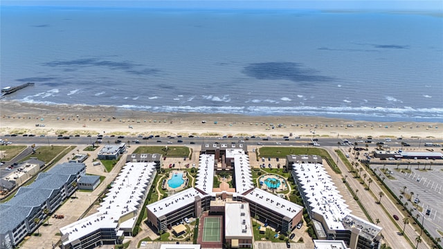 birds eye view of property with a view of the beach and a water view