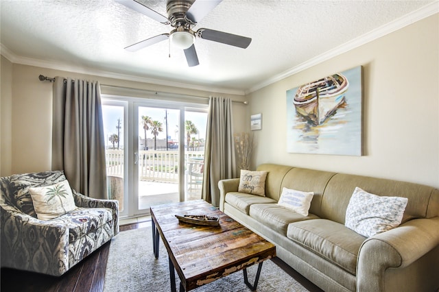 living room featuring a textured ceiling, crown molding, ceiling fan, and hardwood / wood-style flooring